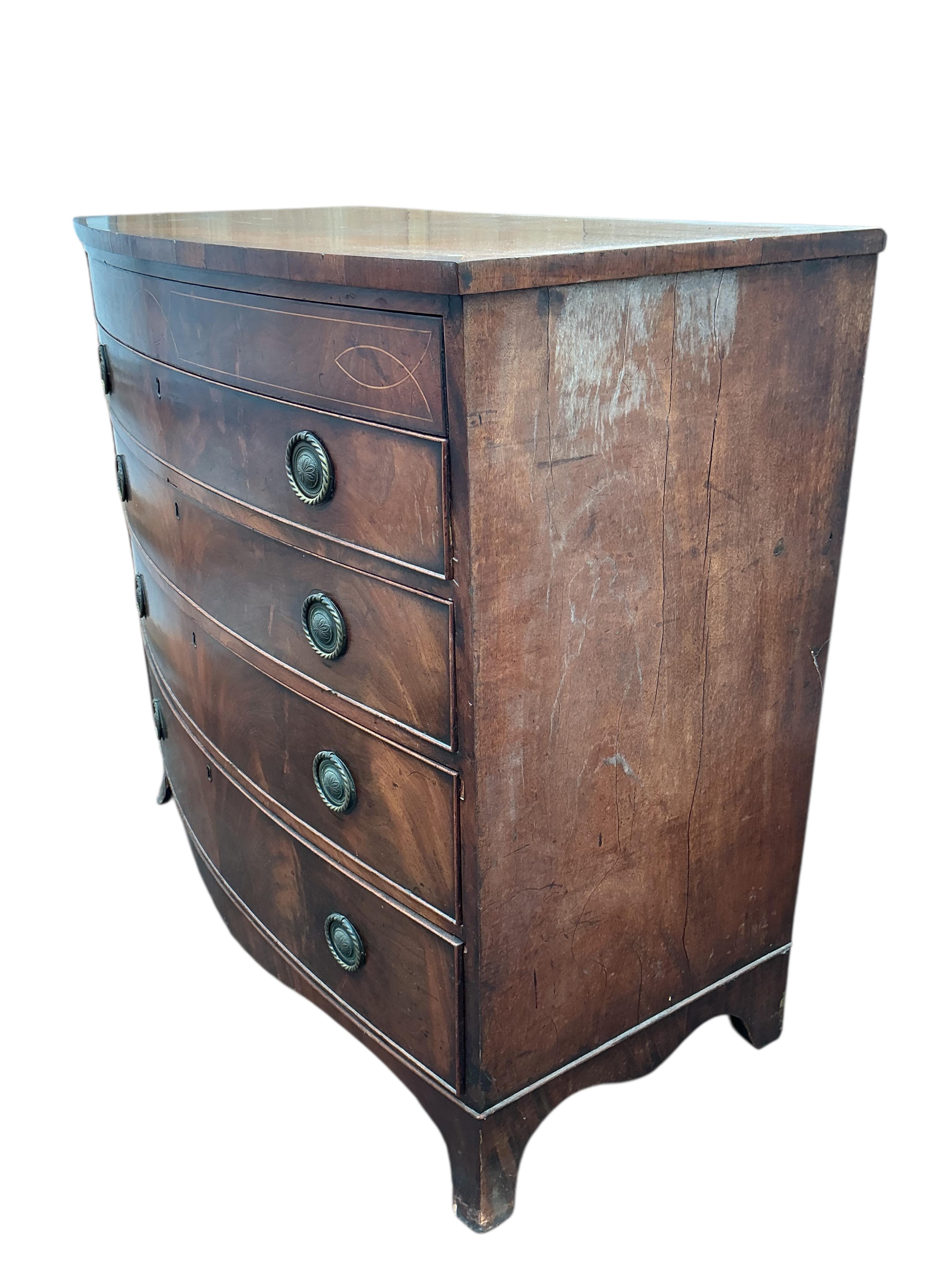 A Regency inlaid mahogany bowfront chest of drawers, width 106cm, depth 56cm, height 100cm